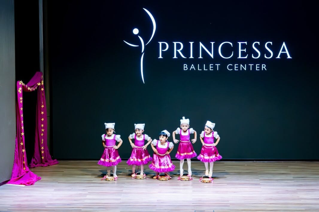 Young dancers in magenta tutus on the Princessa stage